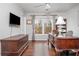 Home office with beautiful desk, television and natural light at 6435 Ivey Creek Cir, Cumming, GA 30040