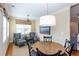 Bright breakfast nook with granite table, modern seating, and natural light from the large windows at 950 Brook Knoll Ln, Cumming, GA 30041