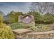 Stone entrance sign with colorful landscaping at 950 Brook Knoll Ln, Cumming, GA 30041