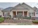 Charming single-story home featuring a brick and siding facade, covered porch, and well-maintained landscaping at 950 Brook Knoll Ln, Cumming, GA 30041