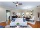 Spacious living area with hardwood floors, stylish decor, and views of the dining room and kitchen at 950 Brook Knoll Ln, Cumming, GA 30041