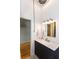 Bathroom featuring vanity with updated fixtures and storage at 1661 La France Ne St # 216, Atlanta, GA 30307
