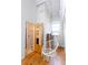 A stylish bedroom featuring a fun hanging chair and a view into the ensuite bath at 1661 La France Ne St # 216, Atlanta, GA 30307