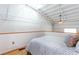 Loft bedroom featuring hardwood floors, sloped ceiling, and a view of the living space below at 1661 La France Ne St # 216, Atlanta, GA 30307