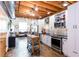 Bright, open kitchen with stainless steel appliances, white cabinets, and an island at 1661 La France Ne St # 216, Atlanta, GA 30307