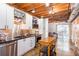 Modern kitchen boasting stainless steel appliances, a convenient kitchen island, and seamless access to an outdoor patio at 1661 La France Ne St # 216, Atlanta, GA 30307