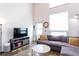 Bright living room with high ceilings, natural light, and comfortable seating at 1661 La France Ne St # 216, Atlanta, GA 30307