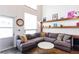 Spacious living room features a large sectional sofa and ample natural light at 1661 La France Ne St # 216, Atlanta, GA 30307