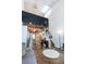 View of living room connecting to kitchen with tall ceilings and modern finishes at 1661 La France Ne St # 216, Atlanta, GA 30307