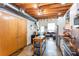 Modern living room and kitchen space with exposed beams, stainless steel appliances, and stylish finishes at 1661 La France Ne St # 216, Atlanta, GA 30307