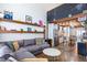 Open living area with modern decor, chalkboard wall, and stainless steel appliances at 1661 La France Ne St # 216, Atlanta, GA 30307