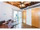 Home office with natural light, a ceiling fan, and sliding glass doors that leads to an outdoor space at 1661 La France Ne St # 216, Atlanta, GA 30307