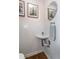 Stylish powder room featuring white herringbone tile, a sleek vessel sink, and decorative art at 1661 La France Ne St # 216, Atlanta, GA 30307