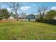 Wide backyard with lush green grass and home in background at 2235 Emerald Springs Dr, Decatur, GA 30035
