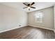 Neutral bedroom features modern ceiling fan, wood floors, and a window for natural light at 2235 Emerald Springs Dr, Decatur, GA 30035