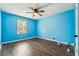 Bright bedroom features modern ceiling fan, wood floors, window providing natural light at 2235 Emerald Springs Dr, Decatur, GA 30035