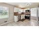 The kitchen featuring stainless steel appliances and white cabinets, is ready for the home chef at 2235 Emerald Springs Dr, Decatur, GA 30035