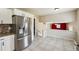 Bright kitchen features stainless steel appliances, tile backsplash, and durable tiled floors at 2235 Emerald Springs Dr, Decatur, GA 30035