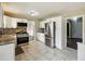 The kitchen features stainless steel appliances and white cabinets, perfect for cooking and gathering at 2235 Emerald Springs Dr, Decatur, GA 30035