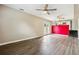 Bright living room with hardwood floors, ceiling fans, and patio doors to the backyard at 2235 Emerald Springs Dr, Decatur, GA 30035