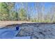 Expansive backyard with a patio that provides a serene and private oasis at 3608 Crayton Glen Way, Buford, GA 30519
