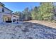 Expansive backyard with a covered patio for outdoor living and serene landscaping at 3608 Crayton Glen Way, Buford, GA 30519