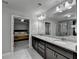 A neutral bathroom features granite counters, tile floor, a soaking tub, and a glass enclosed shower at 3608 Crayton Glen Way, Buford, GA 30519