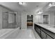 Large bathroom with double vanity sinks, granite counters, separate shower and tub at 3608 Crayton Glen Way, Buford, GA 30519