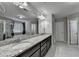 Bathroom with double vanity sinks, large mirror, and walk-in shower and tub at 3608 Crayton Glen Way, Buford, GA 30519