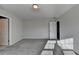 Bright bedroom with soft carpeting, and bright natural light from an exterior window and white doors at 3608 Crayton Glen Way, Buford, GA 30519