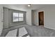 Bright bedroom featuring plush carpet, neutral paint, and an ensuite bathroom at 3608 Crayton Glen Way, Buford, GA 30519