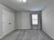 Bright bedroom with plush carpet, a double door closet and natural light from a window at 3608 Crayton Glen Way, Buford, GA 30519