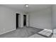 Well-lit bedroom featuring neutral carpet, and bright natural light from an exterior window at 3608 Crayton Glen Way, Buford, GA 30519