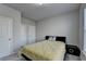 Comfortable bedroom with neutral walls, plush carpet, and ample closet space at 3608 Crayton Glen Way, Buford, GA 30519