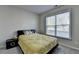 Comfortable bedroom with neutral walls, plush carpet, and a bright window view at 3608 Crayton Glen Way, Buford, GA 30519