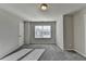 Bright bedroom featuring plush carpet, neutral paint, and a sun-filled window at 3608 Crayton Glen Way, Buford, GA 30519