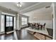Elegant dining room featuring a chandelier and dark hardwood floors at 3608 Crayton Glen Way, Buford, GA 30519