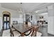 Dining area featuring a chandelier, wood floors, and wainscoting at 3608 Crayton Glen Way, Buford, GA 30519
