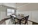 Formal dining room featuring a wood table, chandelier, wainscoting, and a soft white rug for a touch of elegance at 3608 Crayton Glen Way, Buford, GA 30519