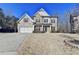 Charming two-story home featuring a combination of brick, stone, and siding, with an attached two-car garage at 3608 Crayton Glen Way, Buford, GA 30519