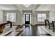 Elegant foyer featuring gleaming hardwood floors, classic trim, and bright natural light at 3608 Crayton Glen Way, Buford, GA 30519