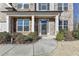 Inviting front porch with brick columns, stone accents, and manicured landscaping at 3608 Crayton Glen Way, Buford, GA 30519