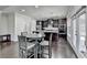 Kitchen with dark cabinetry, stainless appliances, and an eat-in dining area at 3608 Crayton Glen Way, Buford, GA 30519