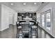 Kitchen with dark cabinetry, stainless appliances, and an eat-in dining area at 3608 Crayton Glen Way, Buford, GA 30519
