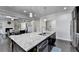 Gourmet kitchen with stainless appliances, granite countertops, and a central island at 3608 Crayton Glen Way, Buford, GA 30519