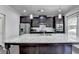 Spacious kitchen island features a granite countertop and dark wood cabinetry at 3608 Crayton Glen Way, Buford, GA 30519