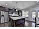 Gourmet kitchen with stainless appliances, granite countertops, and a central island at 3608 Crayton Glen Way, Buford, GA 30519