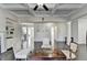 Open-concept living room boasts a decorative coffered ceiling and dark hardwood floors throughout the home at 3608 Crayton Glen Way, Buford, GA 30519