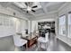 Bright living room featuring hardwood floors, a coffered ceiling, and an open view into the kitchen at 3608 Crayton Glen Way, Buford, GA 30519