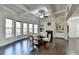 Living room filled with natural light, features a fireplace with built-in shelving and coffered ceilings at 3608 Crayton Glen Way, Buford, GA 30519